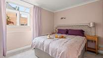 The bedroom offers light, space and comfort.
