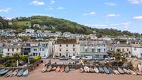 This great aerial shot shows just how central and perfectly positioned you are within the beautiful village of Shaldon. The Sandy Den is the ground floor apartment to the left of the front door of the cream building.