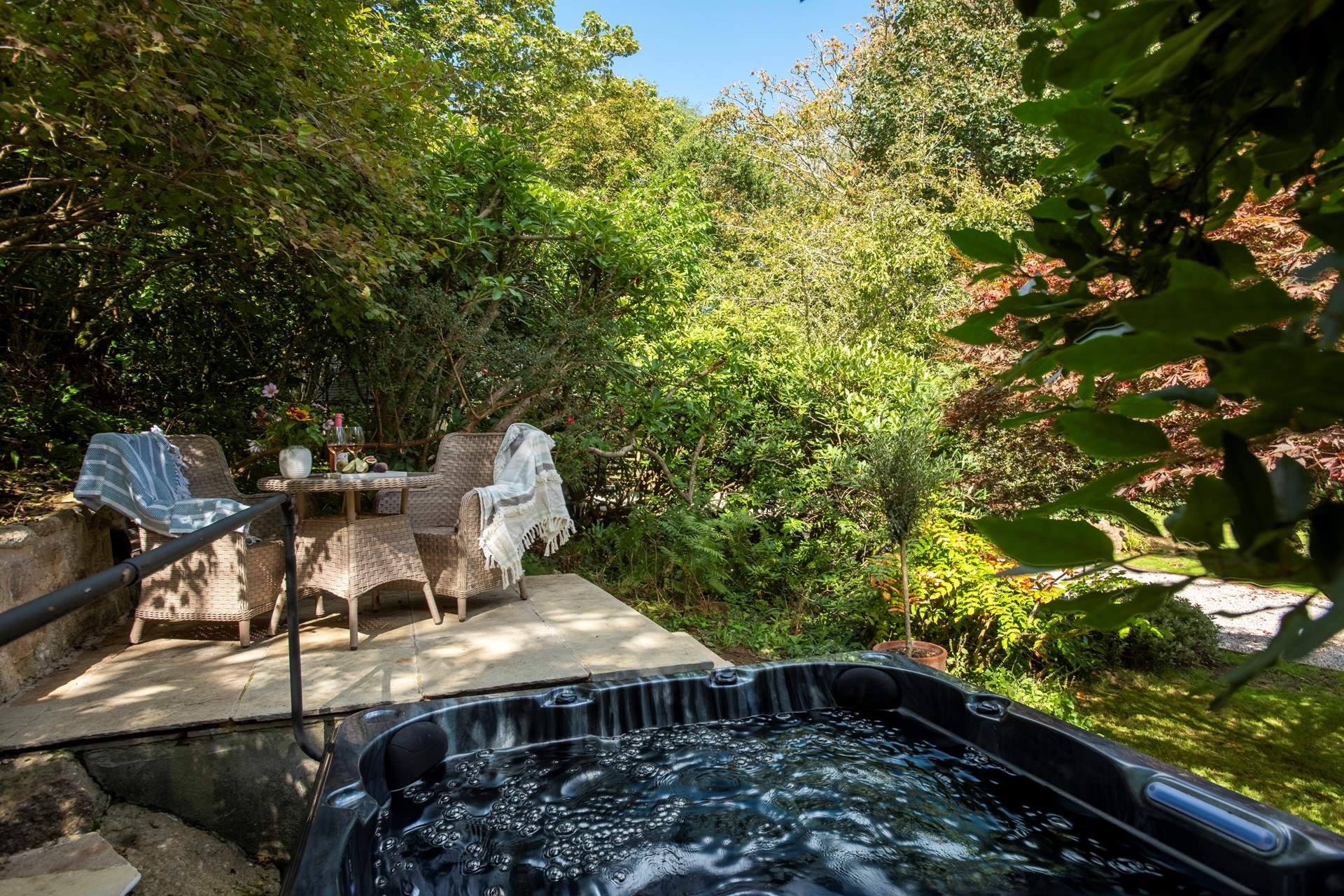 Step outside into the magical garden and relax in the hot tub perfectly positioned in a quiet corner under mature trees.