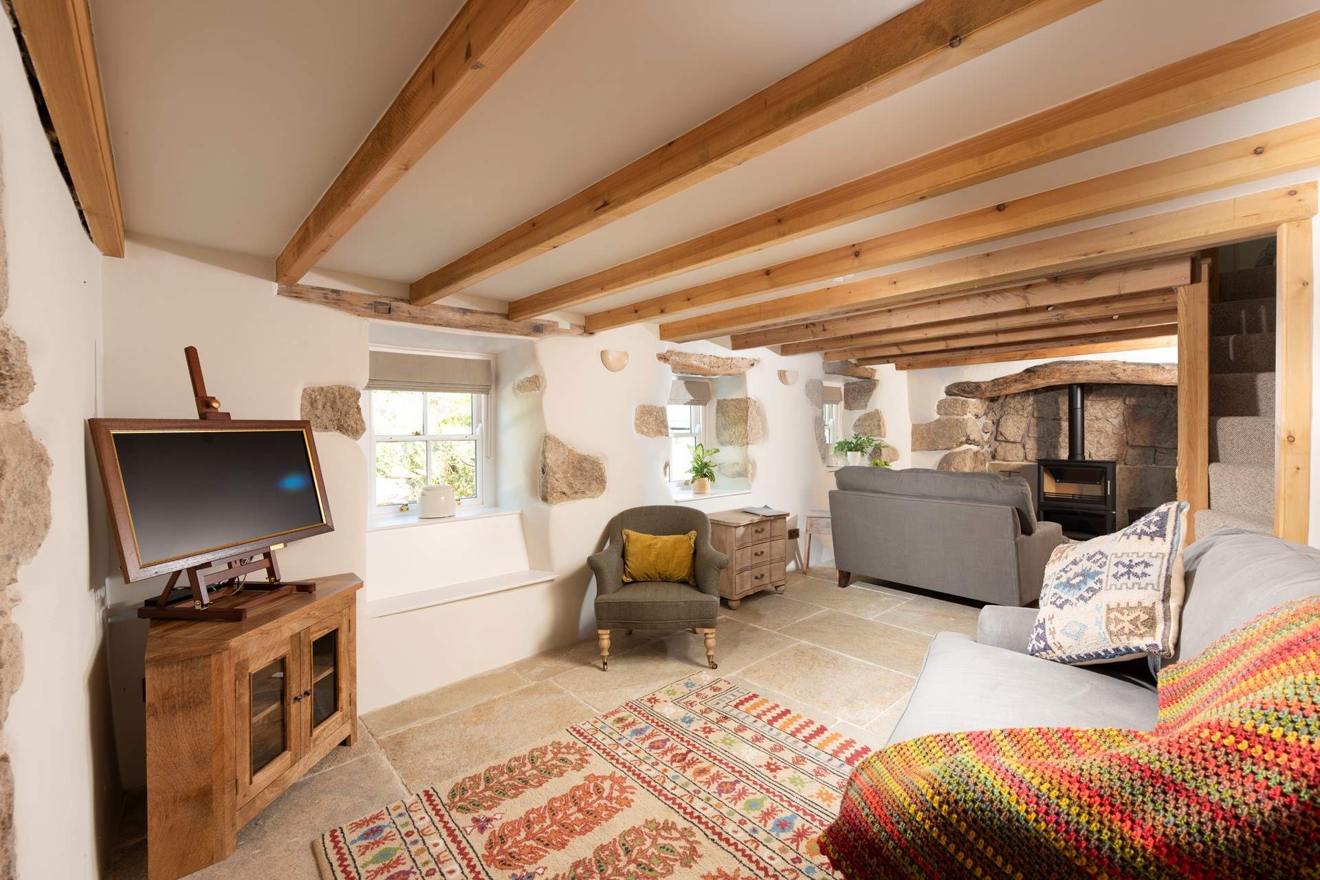 The snug, ideal for quiet moments. The wood-burner is ornamental as there is toasty under-floor heating in here.  A working wood-burner can be found in the main sitting-room.