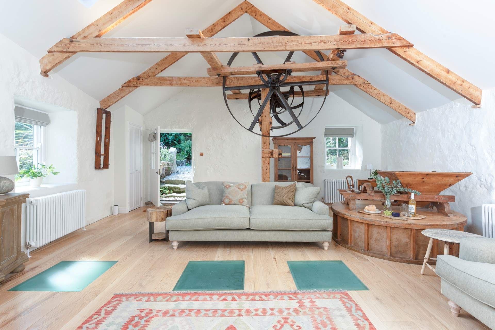 Comfortable sofas invite you to relax in this light-filled space.