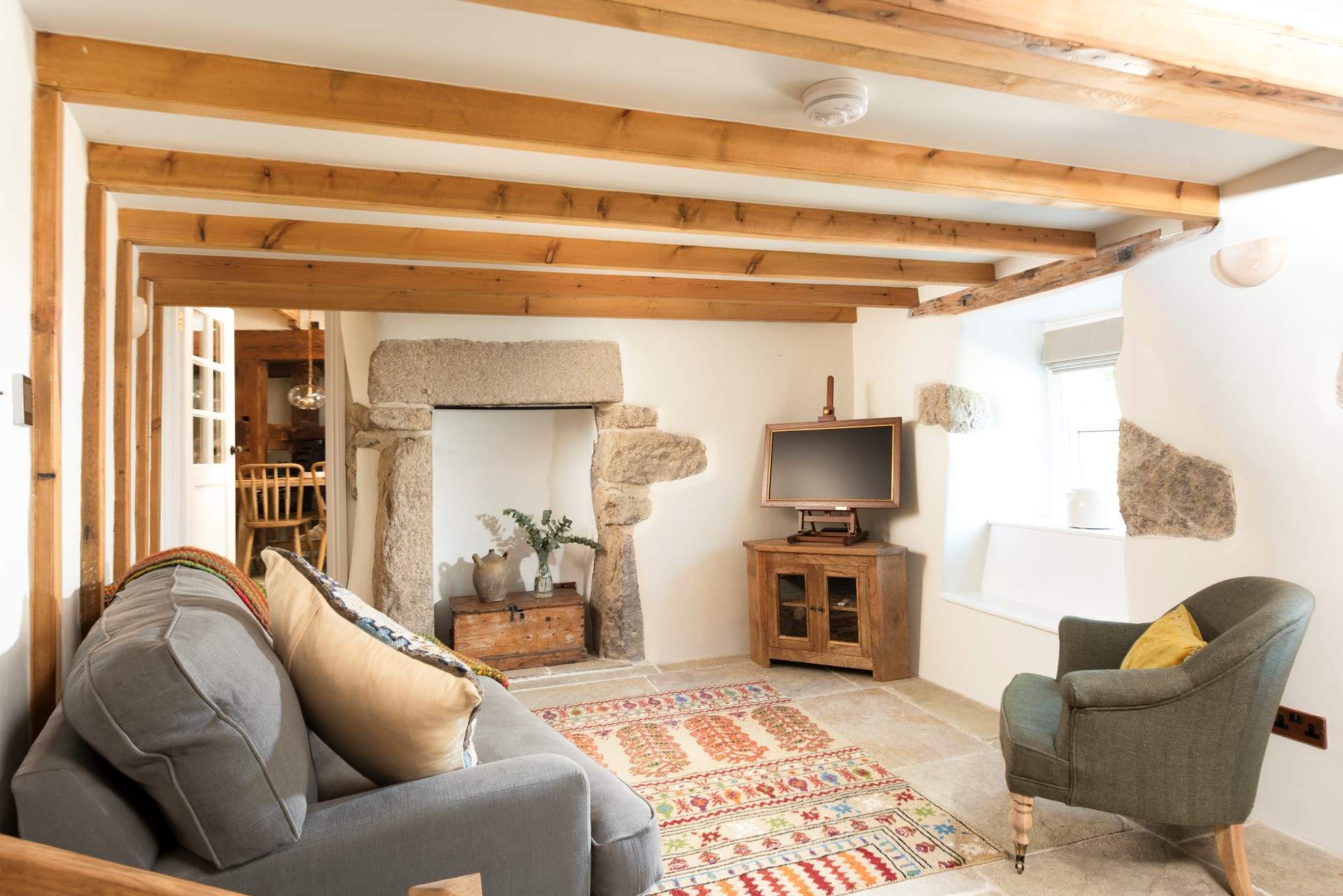 Step down into the snug, a warm and inviting setting.