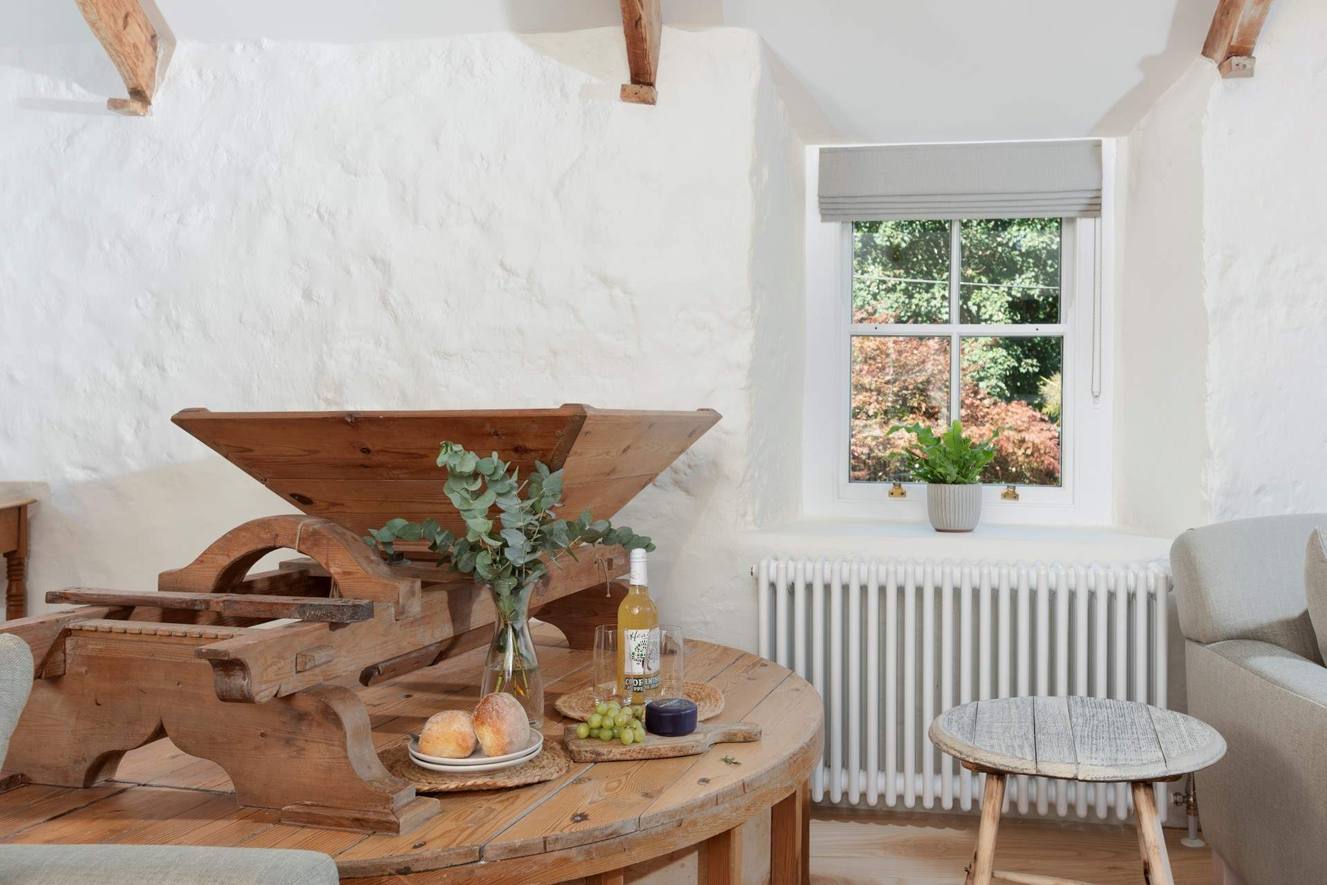 The original hopper in this room provides a fascinating reminder of the building's working past.