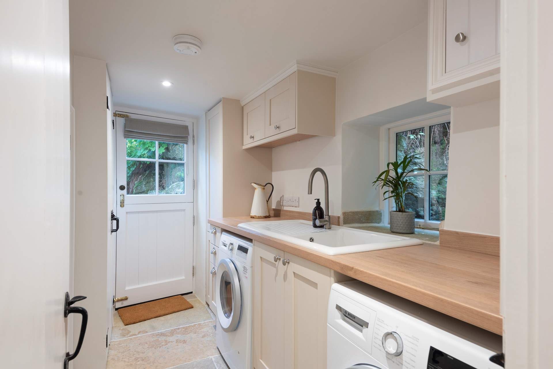 There is a handy utility-room next to the shower-room with washing machine and tumble-drier.