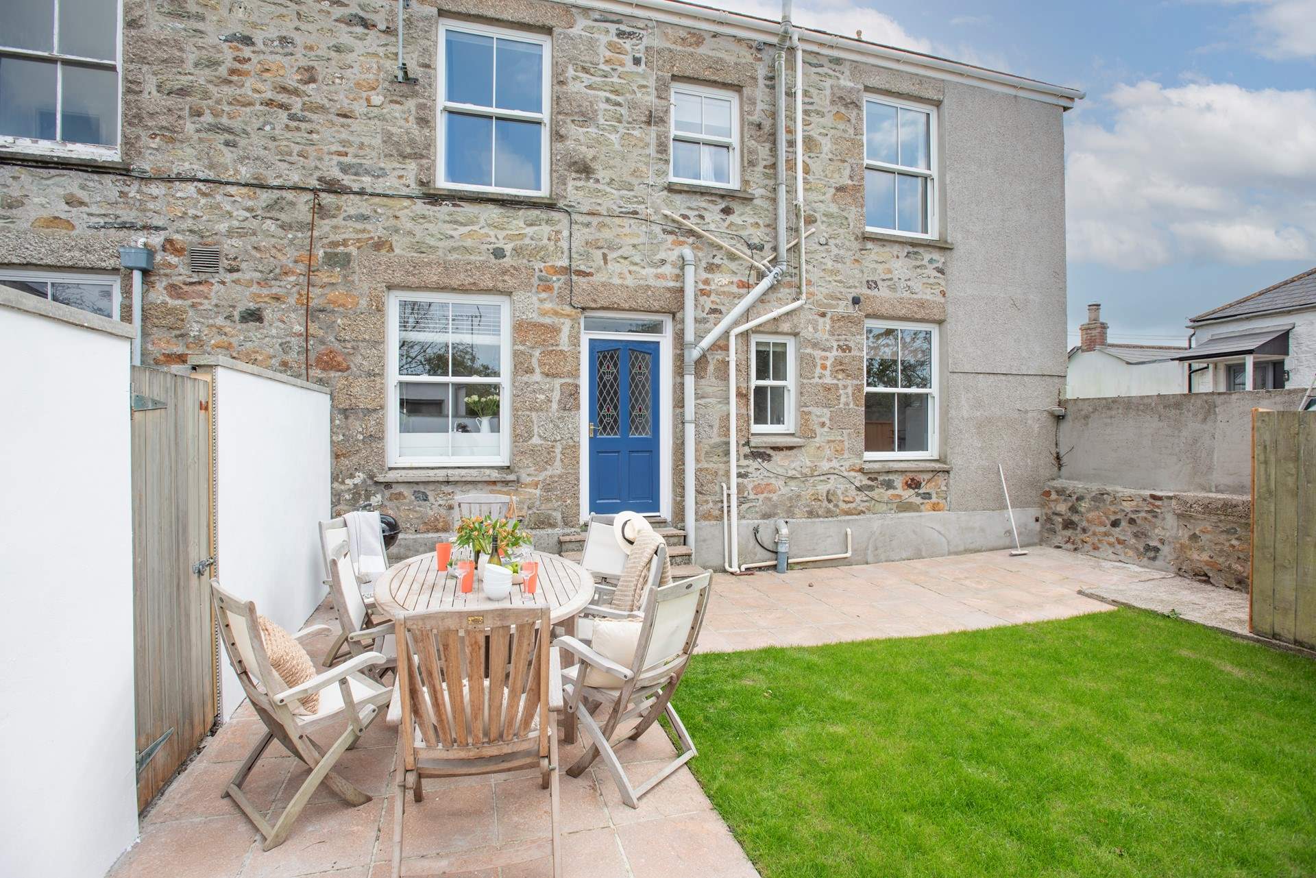 Fire up the barbecue in the sweet garden at the back of the house.