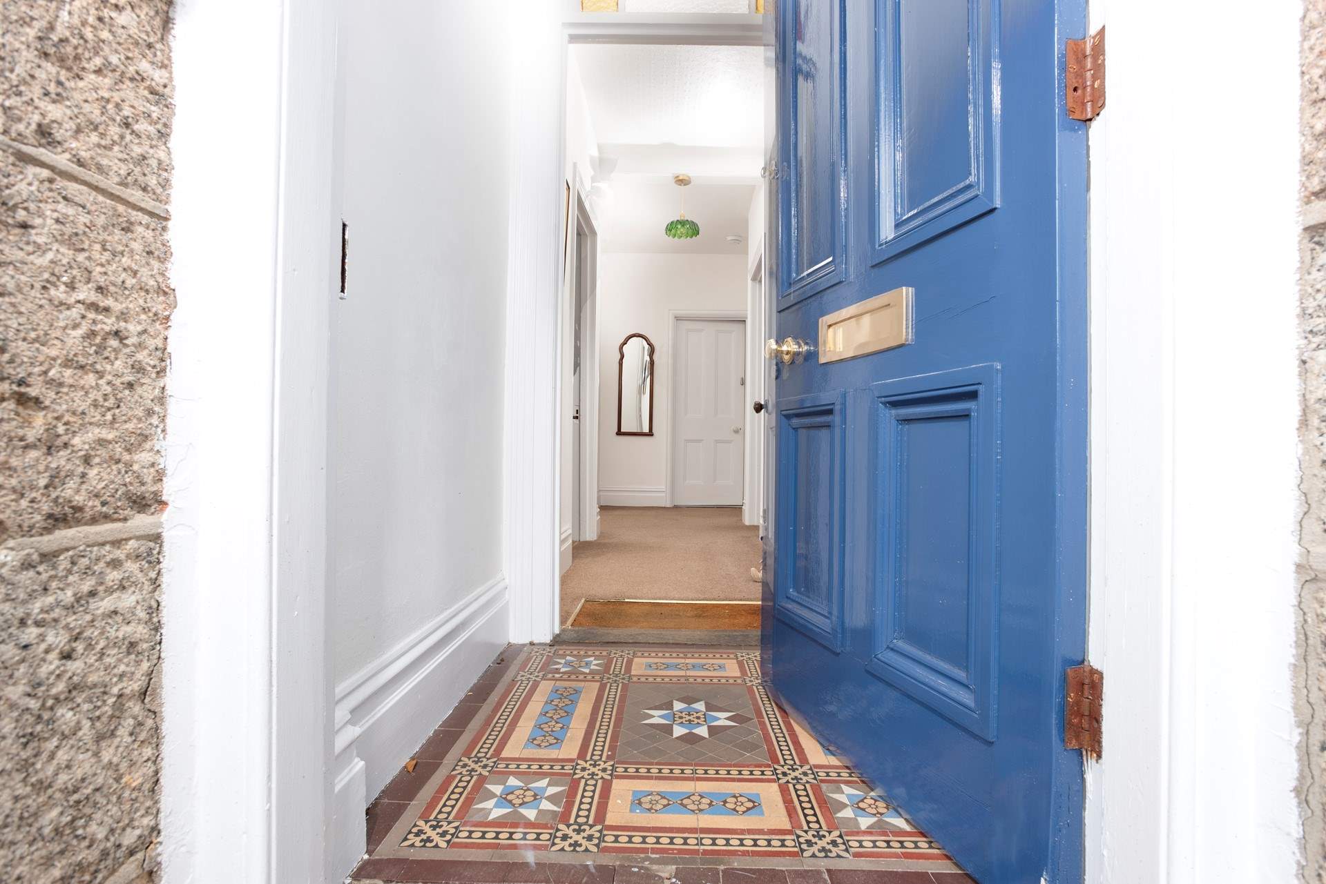 A warm welcome awaits inside this grand home.