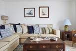 This beautiful light and bright sitting-room has comfy sofas for you to relax in after a busy day exploring the island.