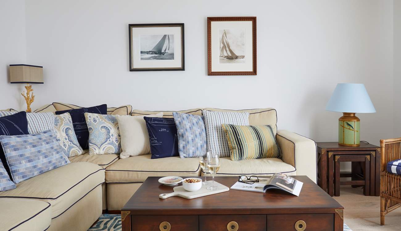 This beautiful light and bright sitting-room has comfy sofas for you to relax in after a busy day exploring the island.