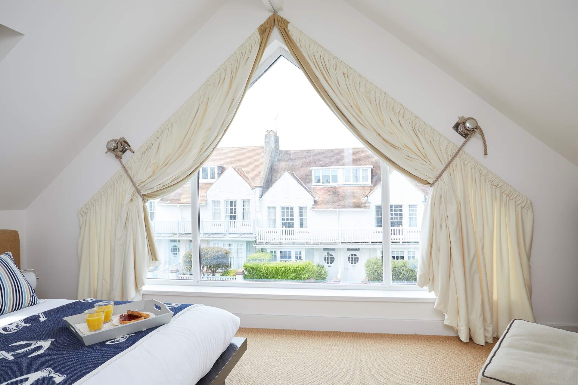 Bedroom 4 has a large window so you can enjoy more of those sea views.