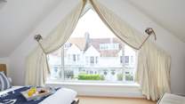 Bedroom 4 has a large window so you can enjoy more of those sea views.