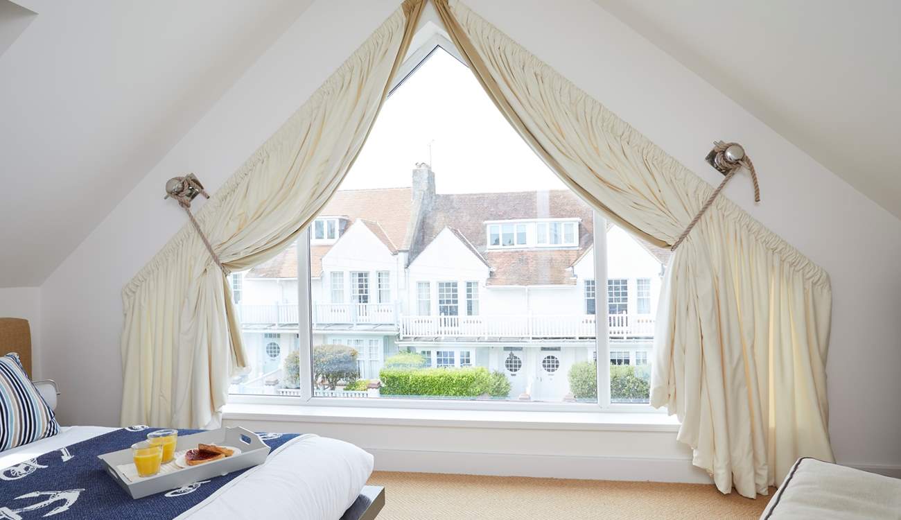 Bedroom 4 has a large window so you can enjoy more of those sea views.
