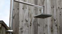 There is even an outside shower in case you need to cool down or wash off those sandy toes.