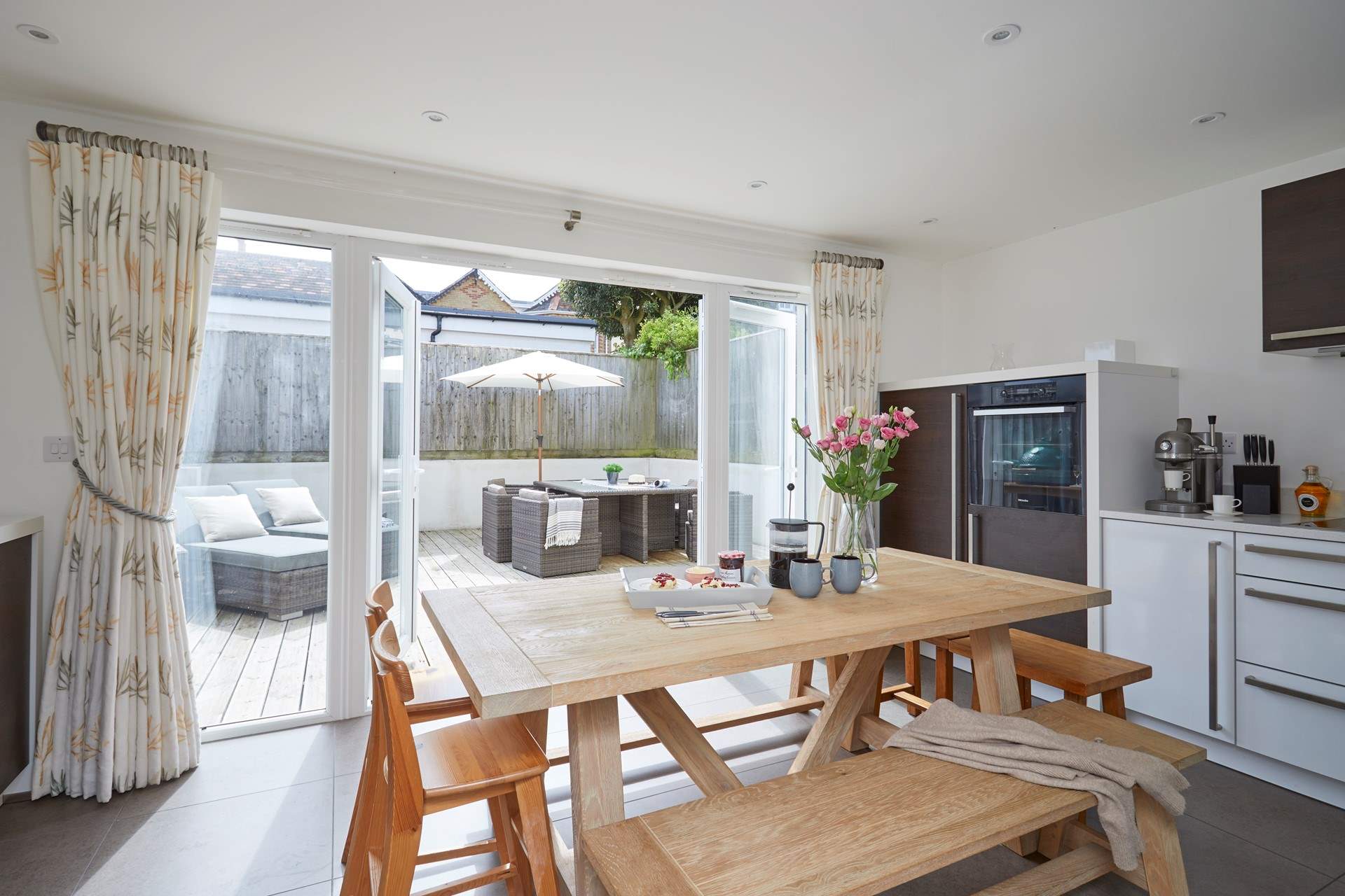 The kitchen/dining-room opens up onto the outside area.