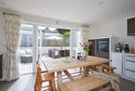 The kitchen/dining-room opens up onto the outside area.