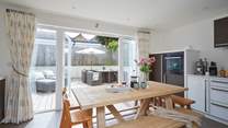 The kitchen/dining-room opens up onto the outside area.