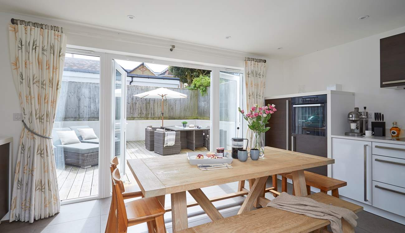 The kitchen/dining-room opens up onto the outside area.