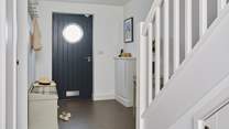 The entrance hall welcomes you into this modern home-from-home.