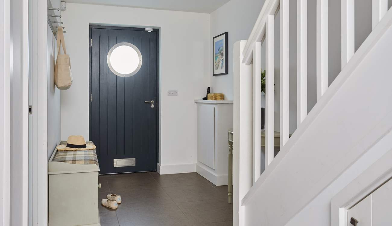 The entrance hall welcomes you into this modern home-from-home.