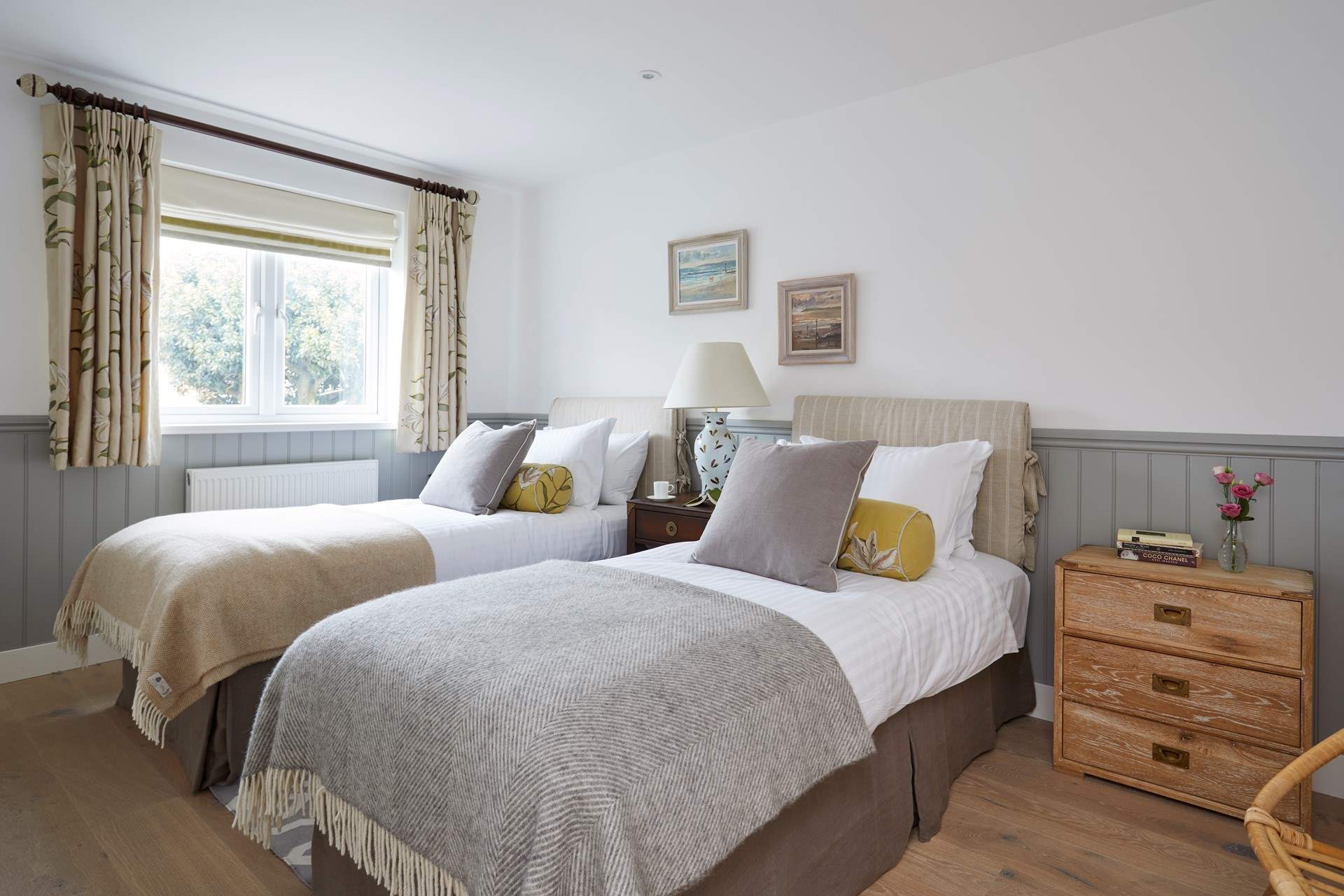 The first floor twin bedroom is located to the rear of the property and overlooks the outside space.