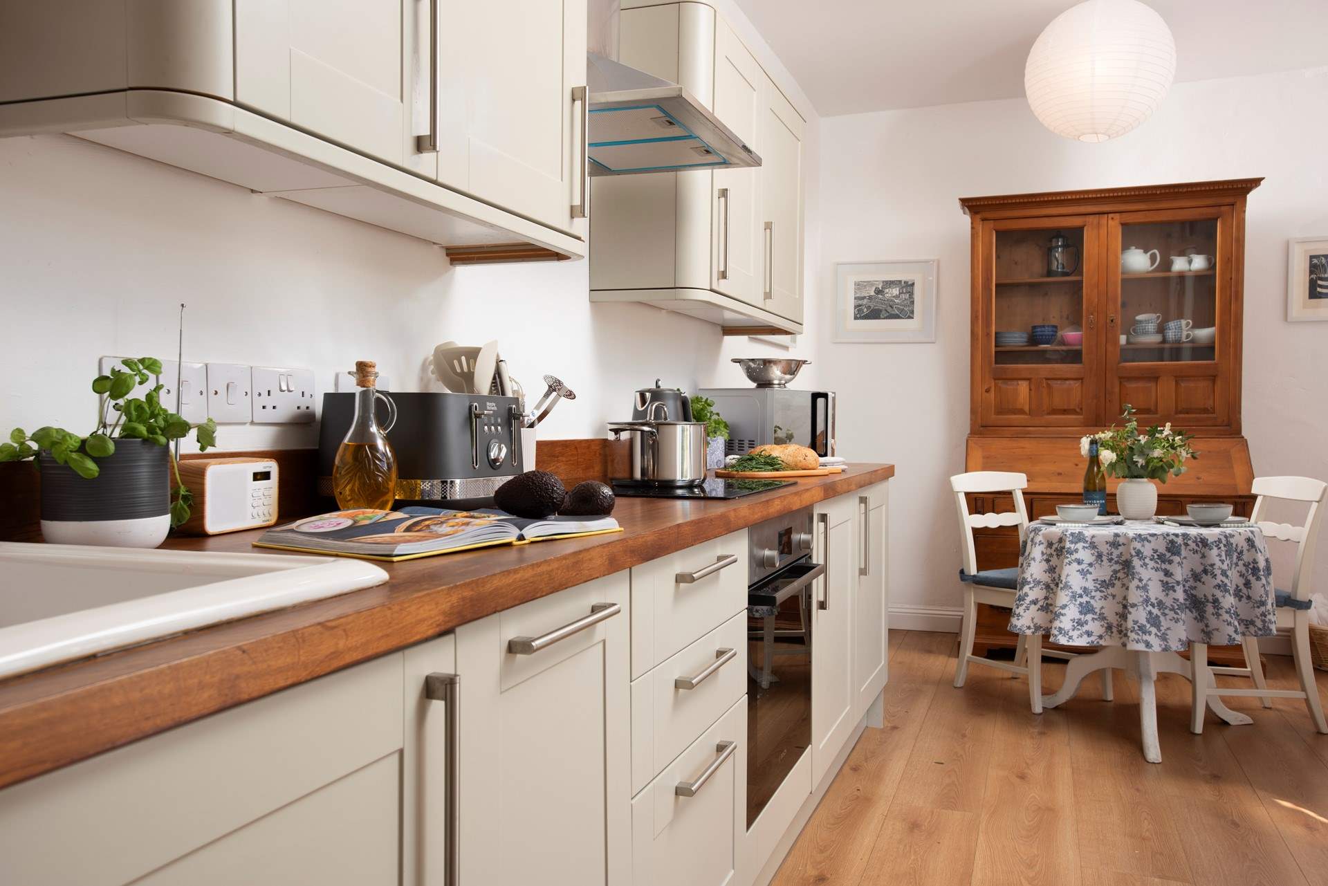 The kitchen has a delightful breakfast table and is fantastically equipped.
