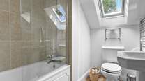The family bathroom with overhead shower. 
