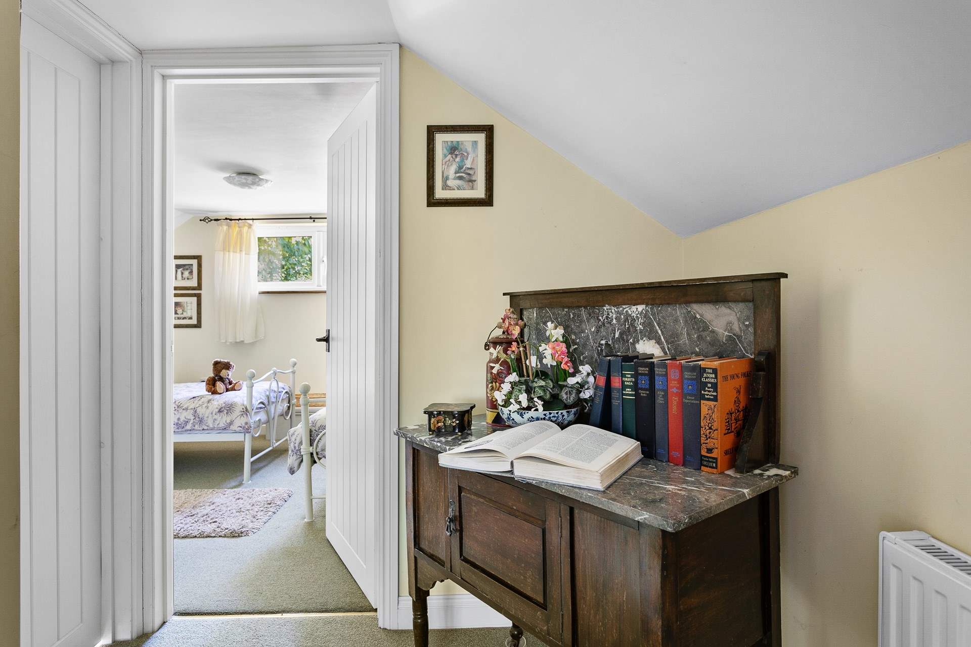 Head across the hallway to the twin bedroom passing the bathroom.
