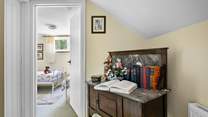 Head across the hallway to the twin bedroom passing the bathroom.