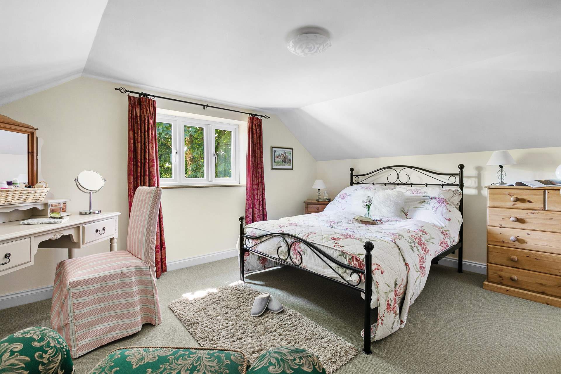 The pretty double bedroom has a gorgeous outlook.