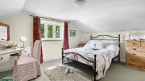 The pretty double bedroom has a gorgeous outlook.