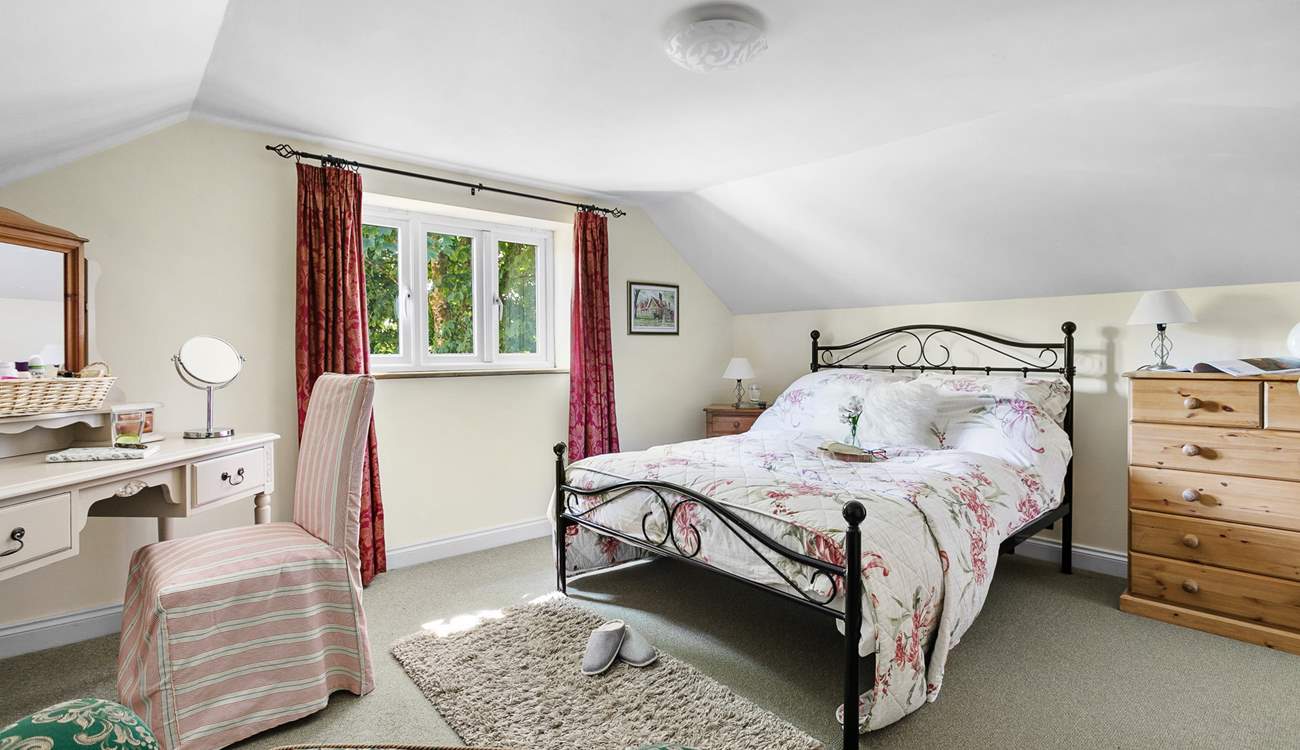 The pretty double bedroom has a gorgeous outlook.