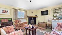 The ground floor is open plan with a cosy and welcoming sitting-area.