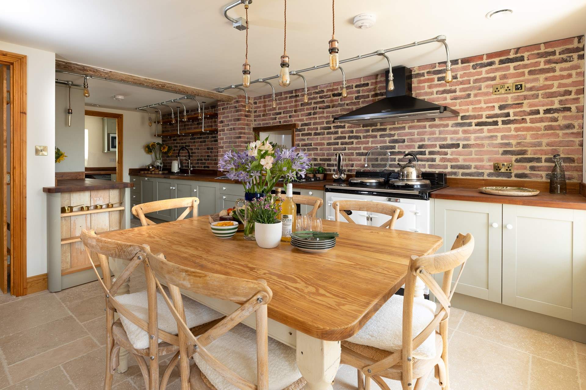 The heart of the home, a beautifully crafted open plan kitchen and dining area overlooking the private garden.