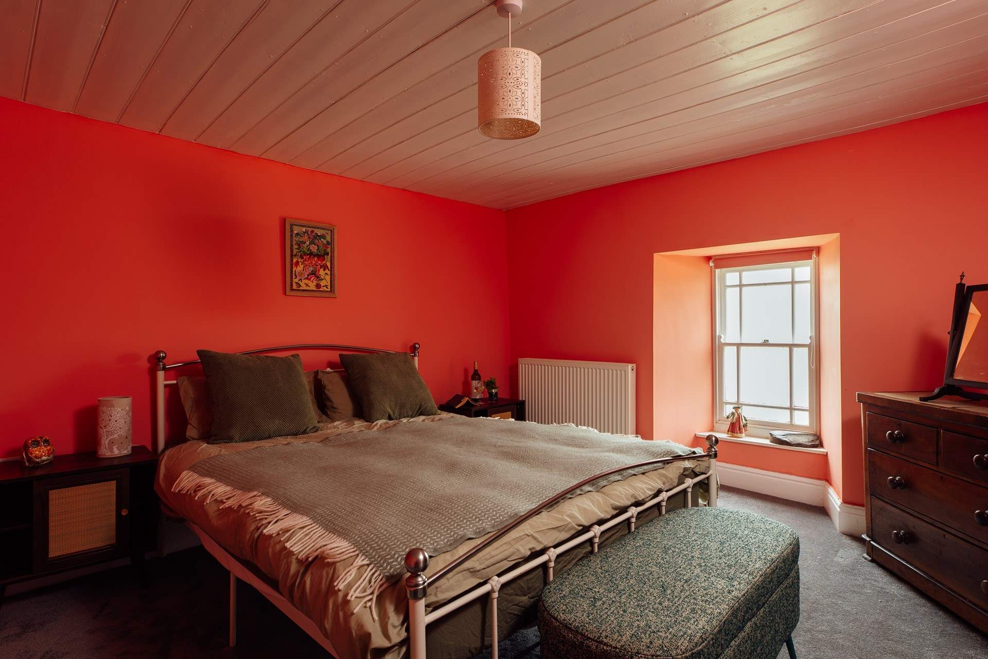 The sea facing king bedroom on the first floor has warming hues. 