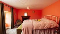 Slow holiday mornings in the sea facing, high double bed on the first floor. 
