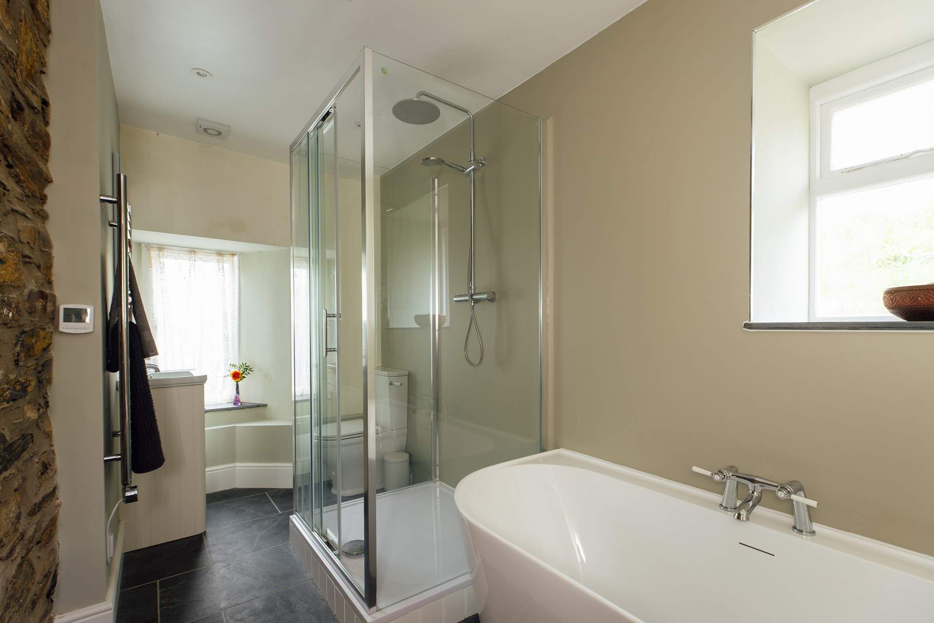 Contemporary bathroom with deep bath and shower. Ideal for some holiday pampering. 