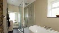 Contemporary bathroom with deep bath and shower. Ideal for some holiday pampering. 