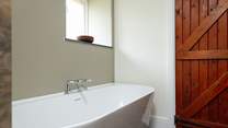 Relax in a luxurious bubbly bath after a day's exploring.