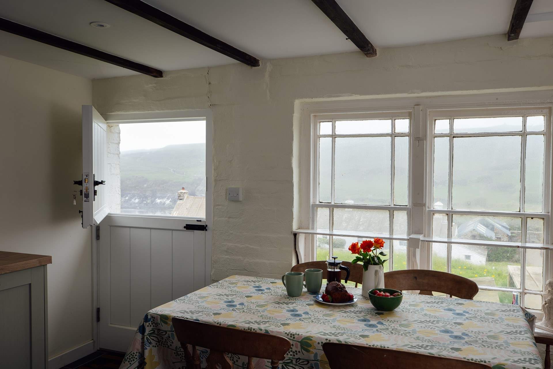 Perfect for a cooling breeze on a summer's day, throw open the stable-door and gaze at the far-reaching sea and beach views. 