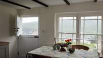 Perfect for a cooling breeze on a summer's day, throw open the stable-door and gaze at the far-reaching sea and beach views. 