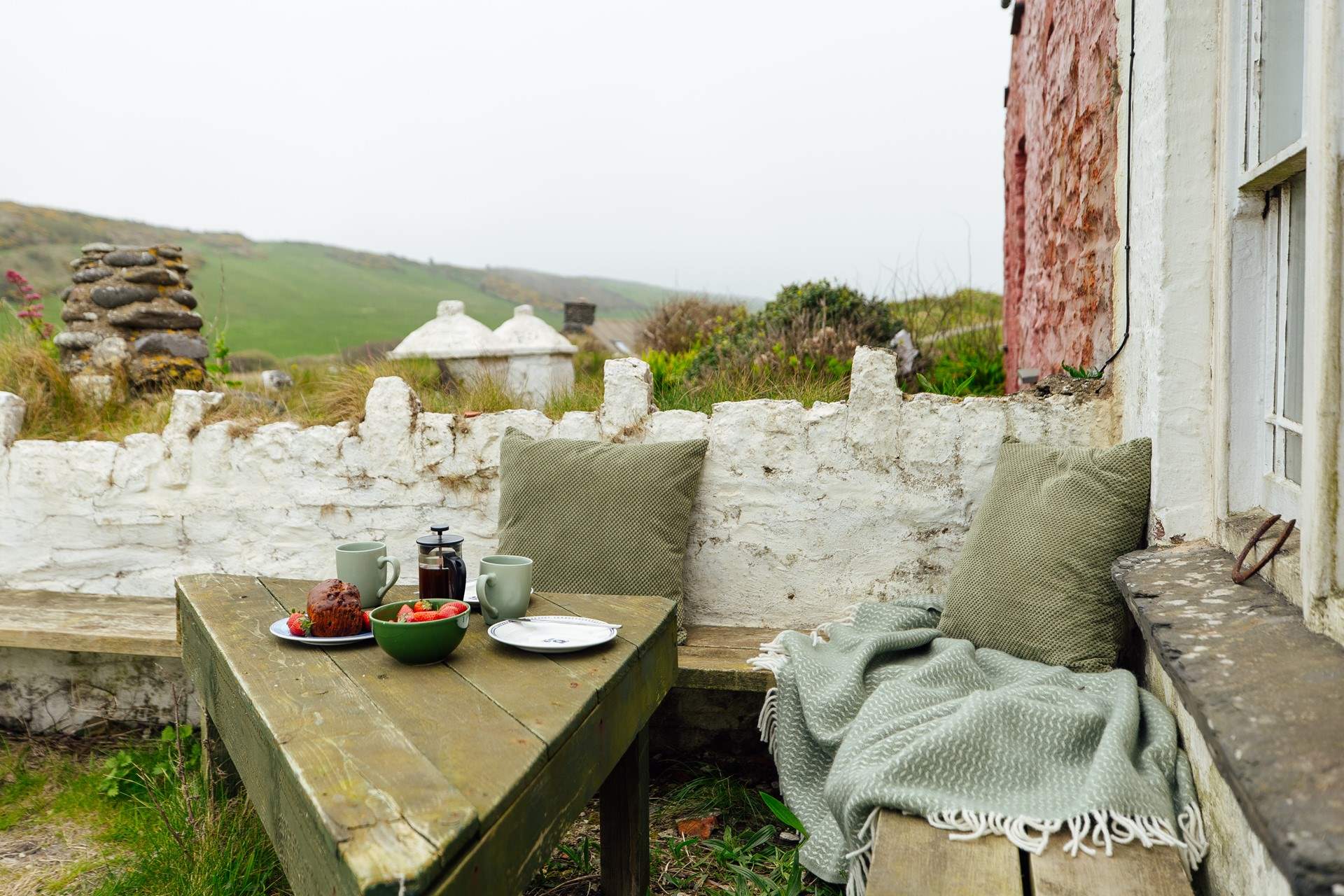 Soak up the glorious beach and sea views from this sweet little corner of the garden. 