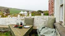 Soak up the glorious beach and sea views from this sweet little corner of the garden. 