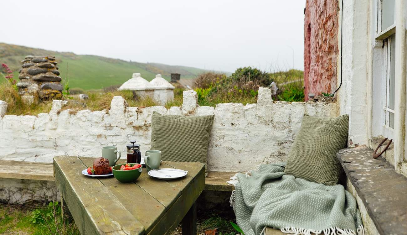 Soak up the glorious beach and sea views from this sweet little corner of the garden. 