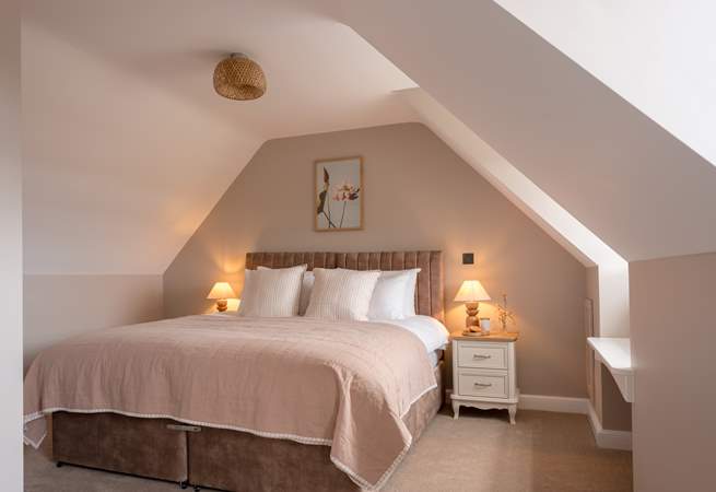 Soft earthy tones welcome you to one of six elegant bedrooms.