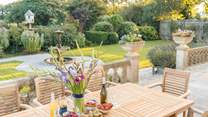 Dine al fresco on the spacious front terrace overlooking the fountain.