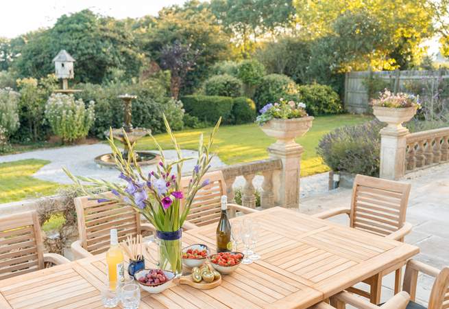 Dine al fresco on the spacious front terrace overlooking the fountain.