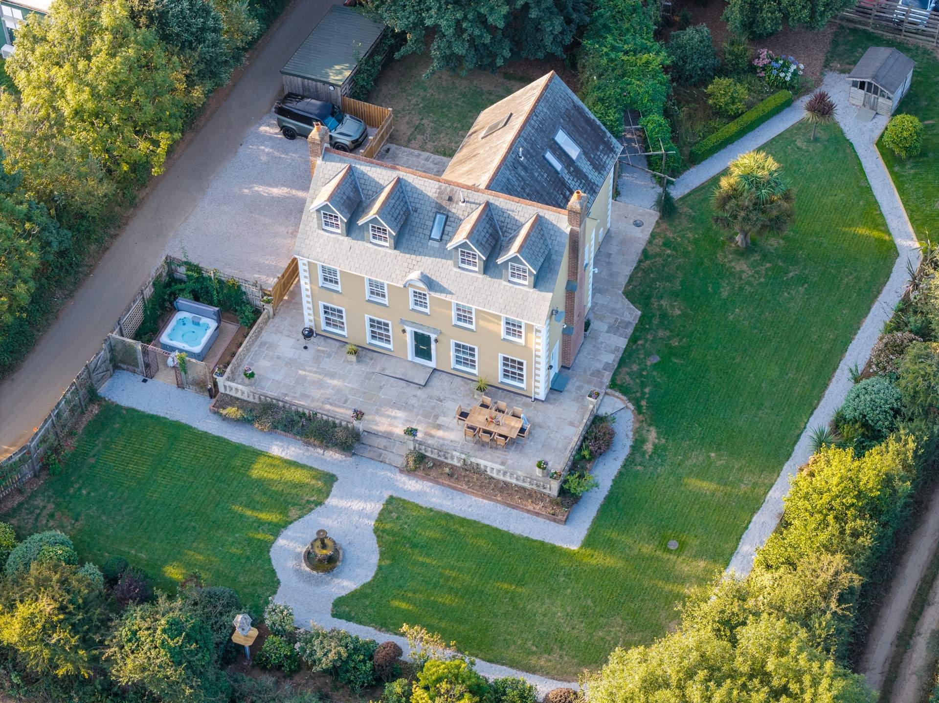 An aerial view of this lovely home showing the parking area.