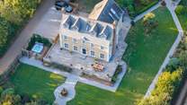 An aerial view of this lovely home showing the parking area.