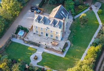 An aerial view of this lovely home showing the parking area.