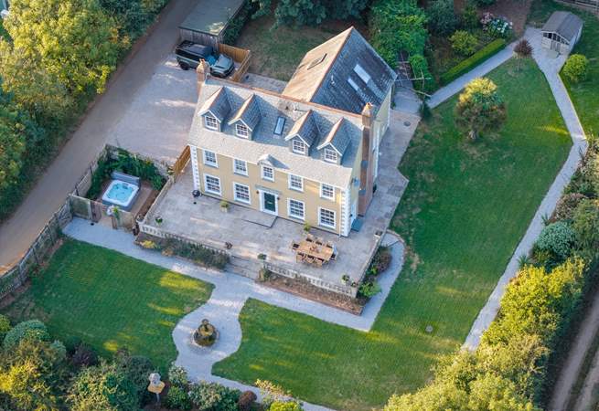 An aerial view of this lovely home showing the parking area.