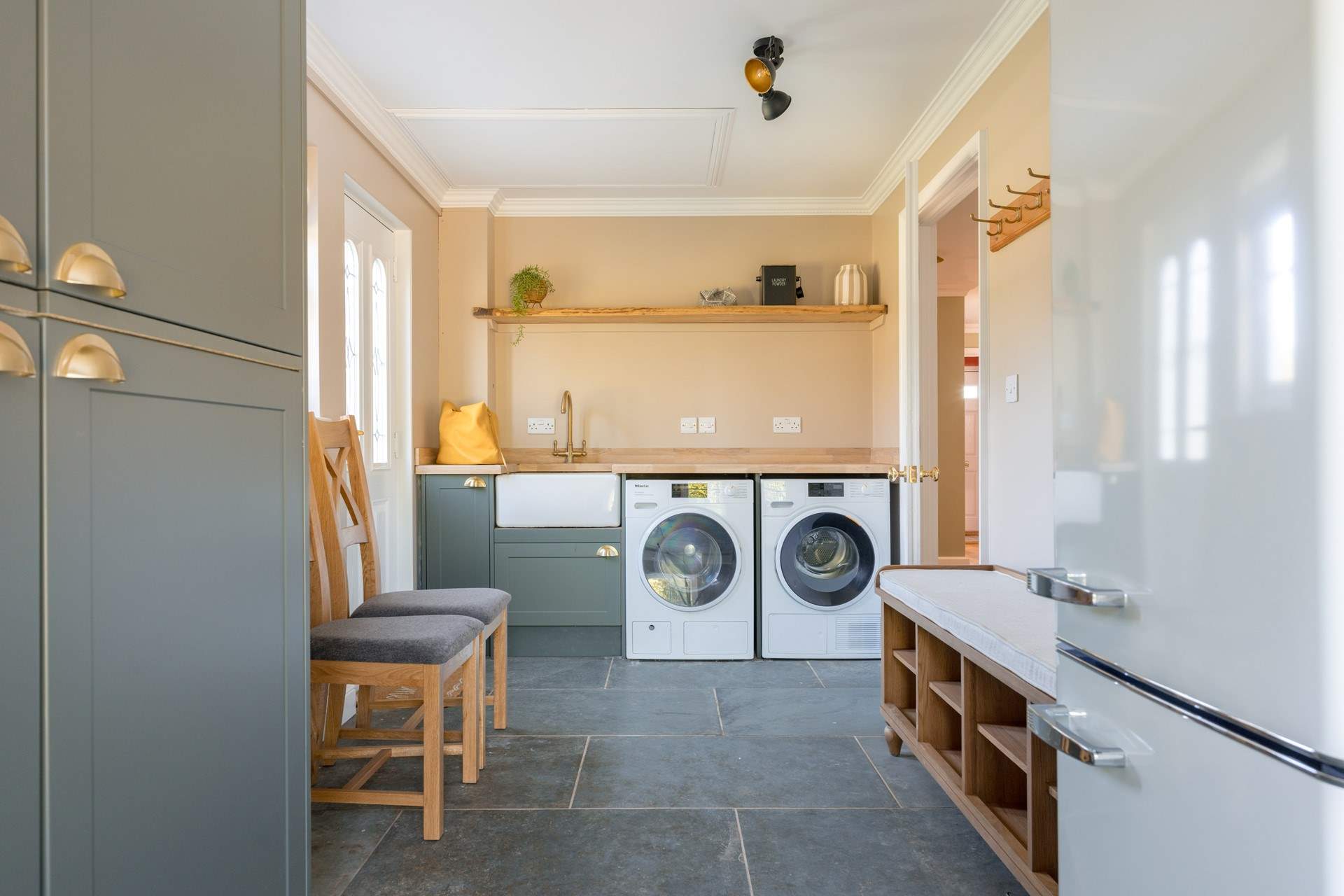 There is a fully equipped utility-room with an extra fridge/freezer.